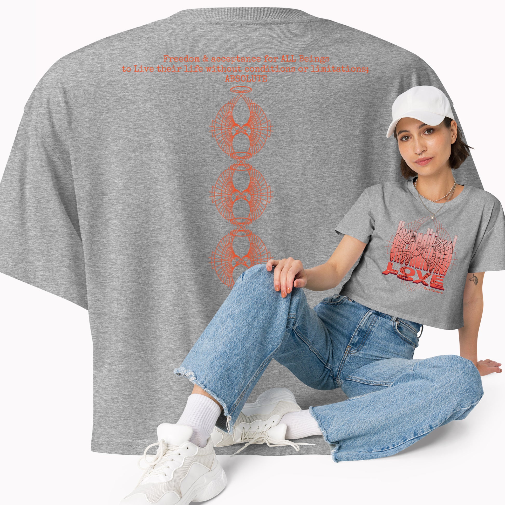 Model showcasing the front of the Unconditional Love design in orange crop top on Athletic Heather  color featuring a minimalist design on the front with mindful messaging, and a back product view displaying the phrase 'Unconditional Love: Freedom & Acceptance for All Beings' along with three stacked Rose Fibonacci Designs logos