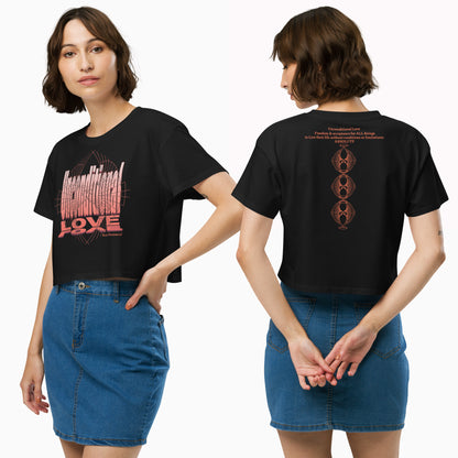 Model showcasing the Unconditional Love design in orange crop top on Mineral Black design on the front with mindful messaging, and the back displaying the phrase 'Unconditional Love: Freedom & Acceptance for All Beings' along with three stacked Rose Fibonacci Designs logos