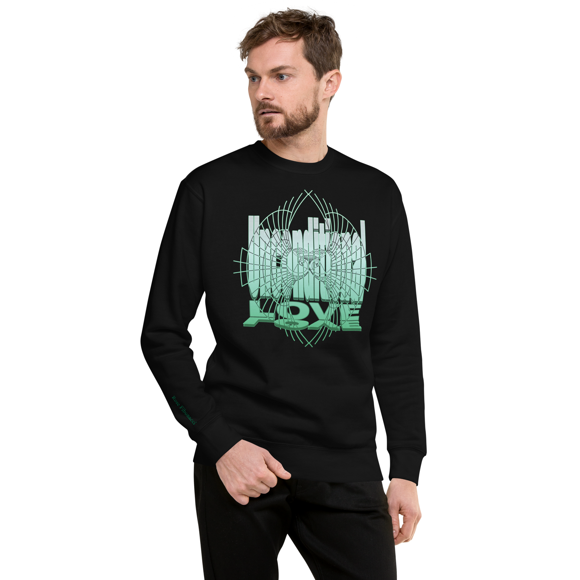 Male model wearing a black unisex sweatshirt with green 'Unconditional Love' design featuring the words and a heart with wings in a torus shape, symbolizing mindfulness and compassion