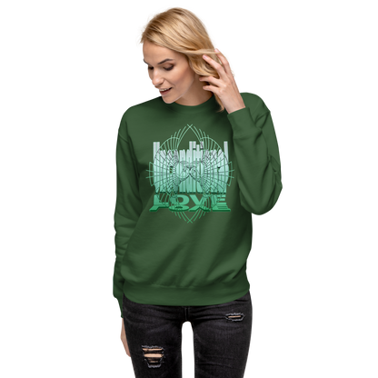 Female model wearing a forest green unisex sweatshirt with green 'Unconditional Love' design featuring the words and a heart with wings in a torus shape, symbolizing mindfulness and compassion