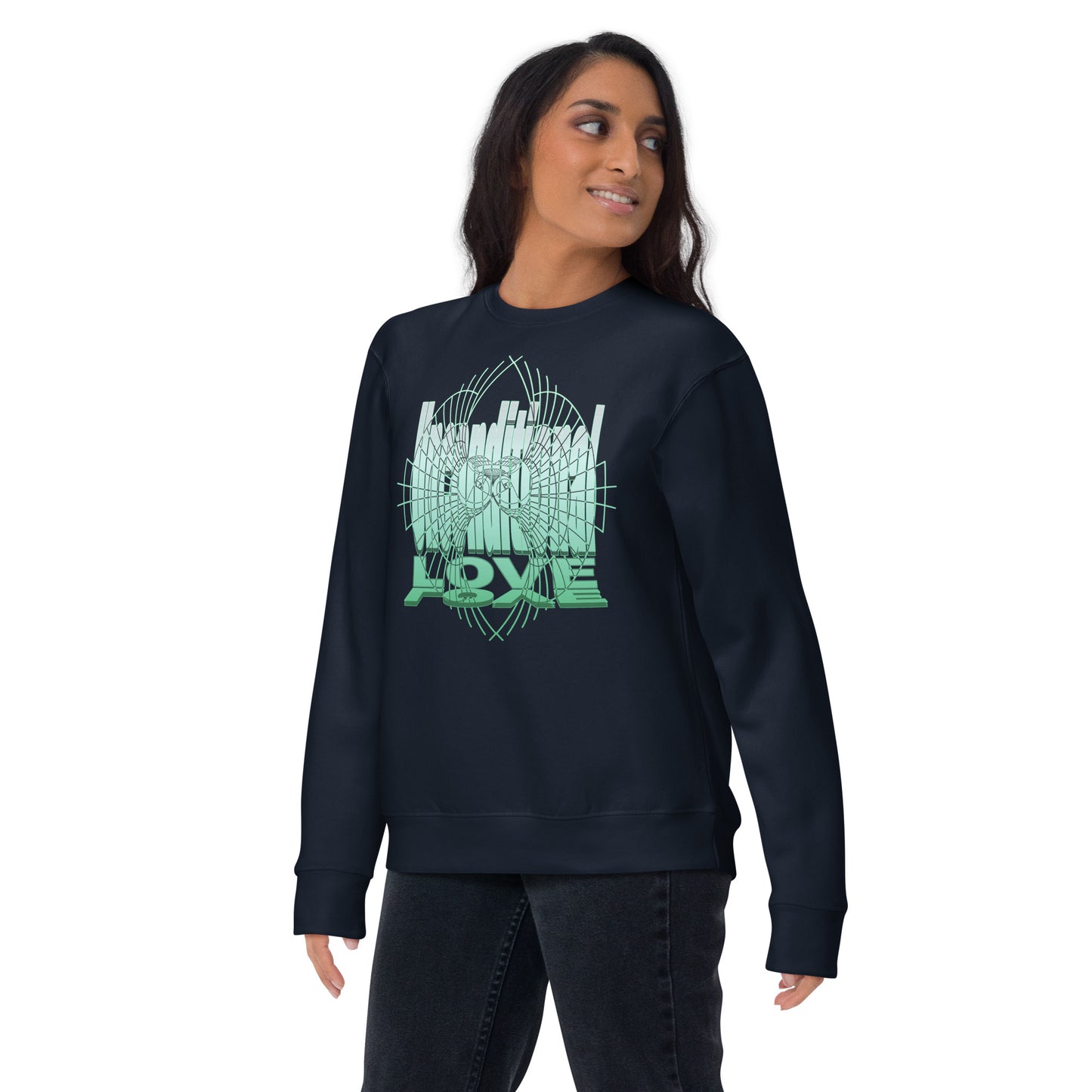 Female model wearing a navy unisex sweatshirt with green 'Unconditional Love' design featuring the words and a heart with wings in a torus shape, symbolizing mindfulness and compassion.